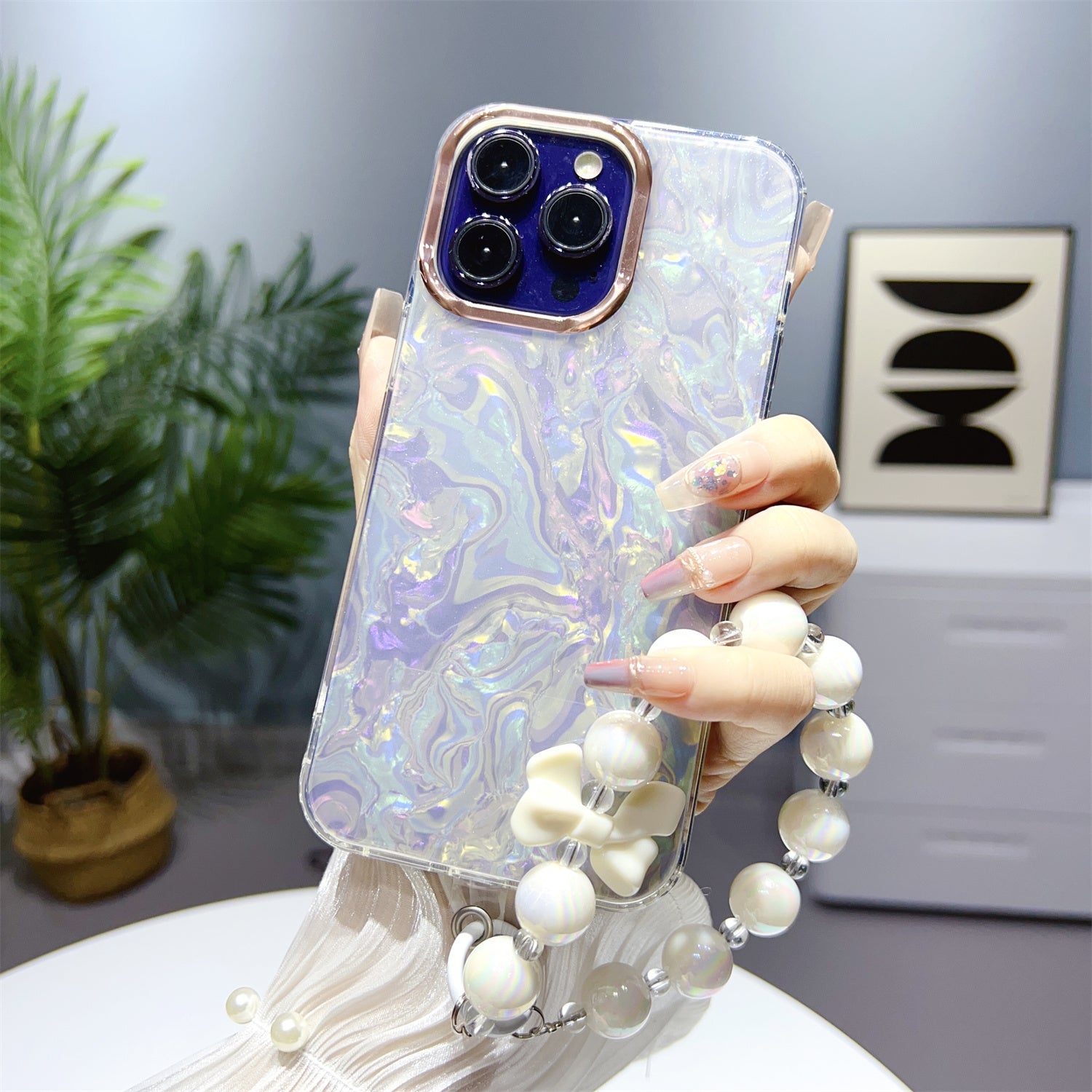 Uniqkart for iPhone 13 Pro Max 6.7 inch TPU+PC Phone Cover IMD Shell Pattern Anti-drop Case with Pearl Hand Chain - Light Grey Uniqkart for iPhone 13 Pro Max 6.7 inch TPU+PC Phone Cover IMD Shell Pattern Anti-drop Case with Pearl Hand Chain - Light Grey